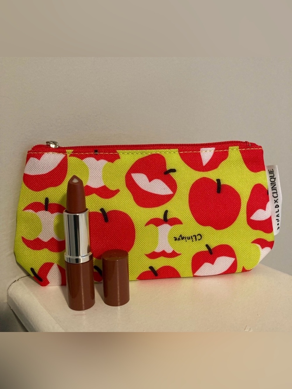 CLINIQUE Apple art makeup bag with Clinique Lipstick in “Tender Heart”